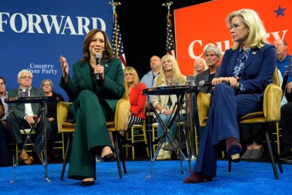 Democratic presidential nominee Vice President Kamala Harris speaks as former Republican Co<em></em>ngresswoman Liz Cheney listens during a town hall at The People's Light in Malvern, Pa., Monday, Oct. 21, 2024. (AP Photo/Jacquelyn Martin)